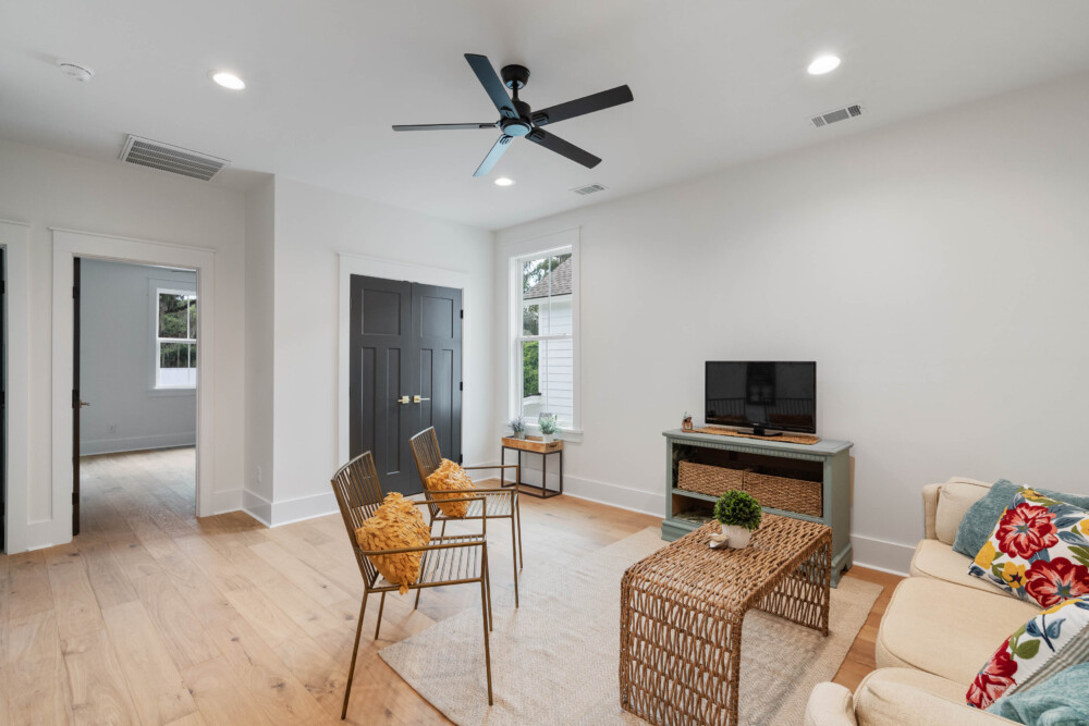 Staged interior with tasteful furniture, décor, and natural lighting.