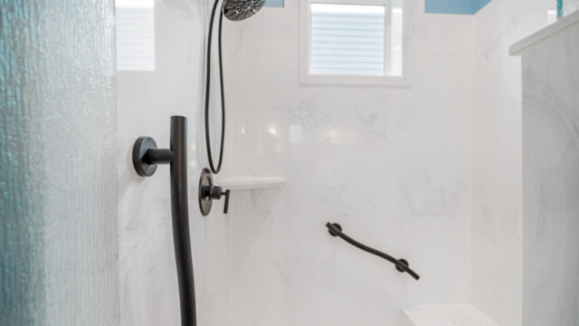 Spacious bathroom featuring a bathtub, vanity, and sleek contemporary fixtures.