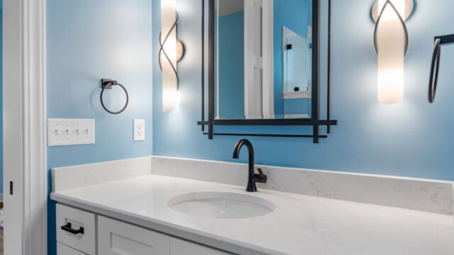 Spacious bathroom featuring a bathtub, vanity, and sleek contemporary fixtures.