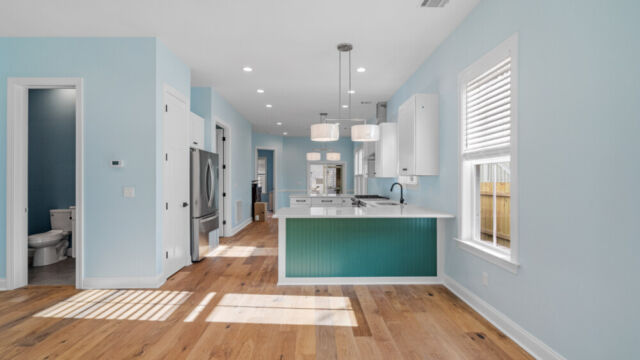 Spacious interior with minimalist design and abundant natural light.