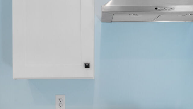 Spacious kitchen with clean lines, countertops, and modern appliances.