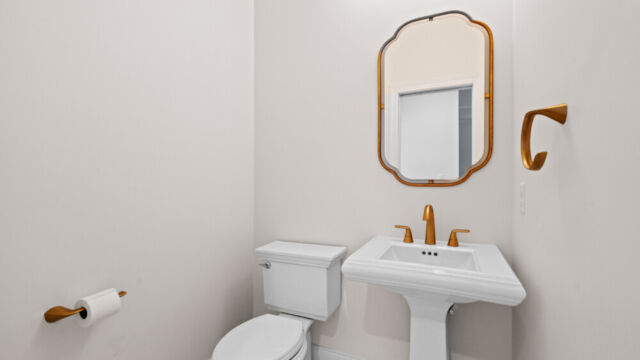 Powder room featuring clean lines, bright lighting, and functional design.