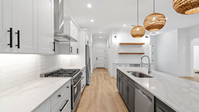 Modern kitchen showcasing a functional island and spacious layout.